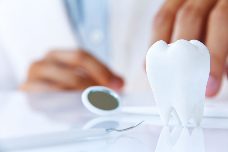 photo placeholder with white tooth and dental tools