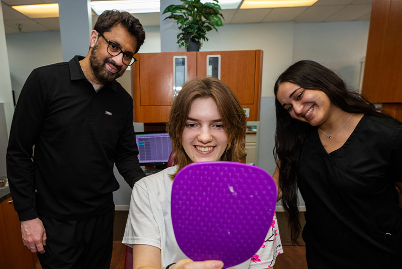Fastbraces Orthodontics patient smiling with Dr. Asim